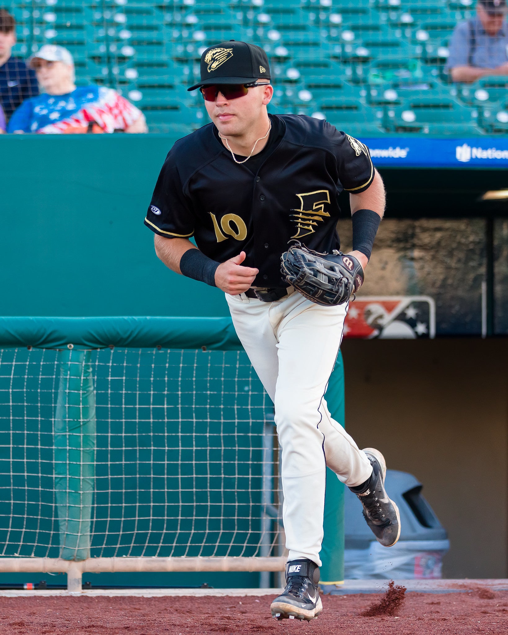 black and gold baseball uniforms